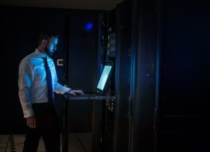 Man researching in server room